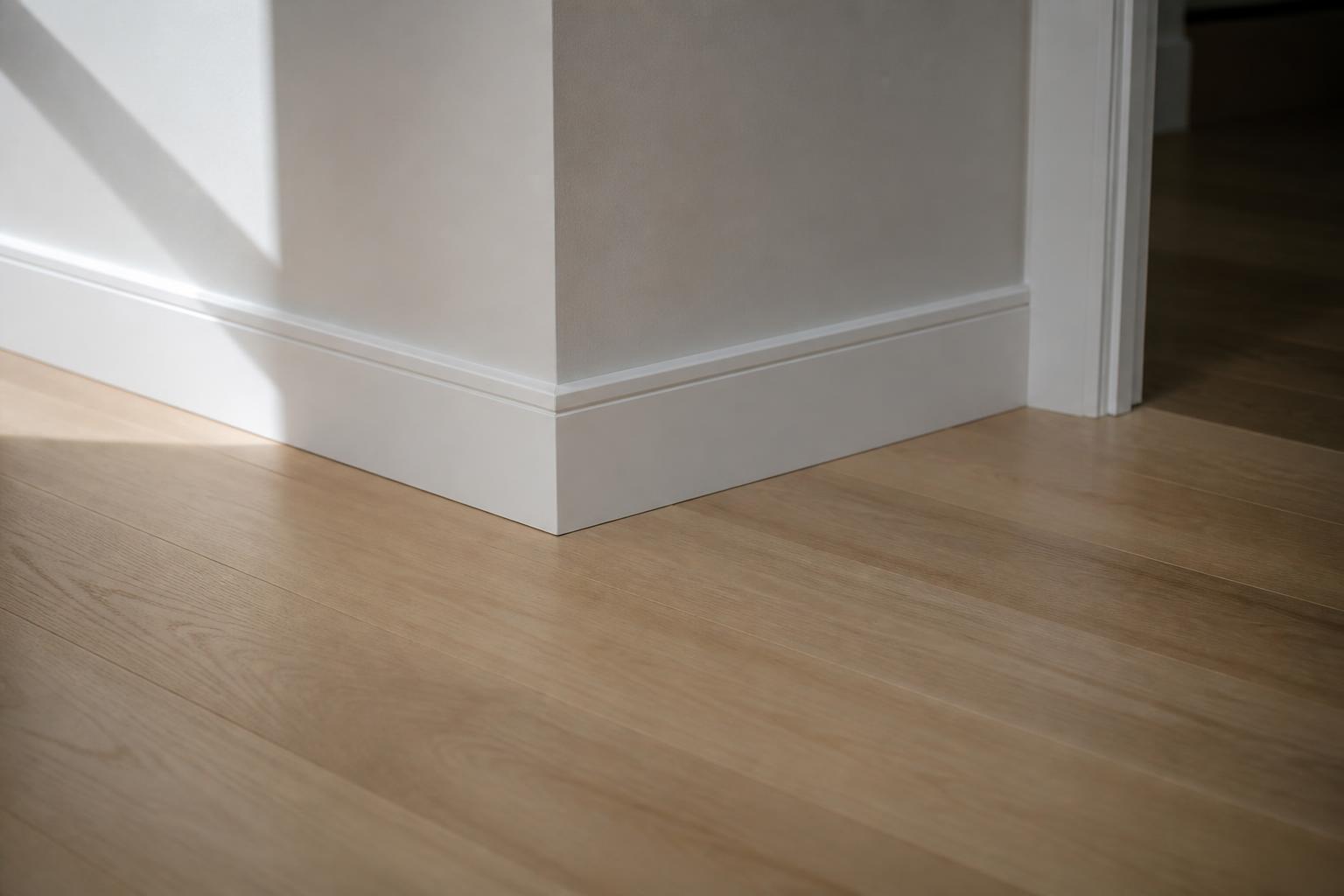 How to Choose Baseboards and Trim to Match Your New Flooring - featured photo